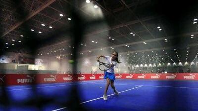 Children in action at the Indoor Tennis courts at the Dubai Sports World. Satish Kumar / The National
