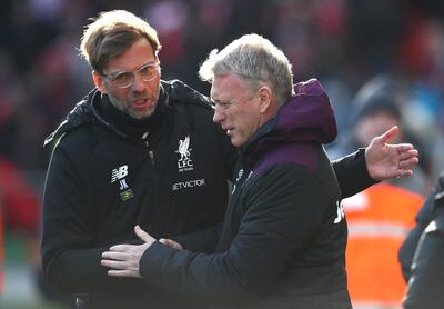 Jurgen Klopp, left, showed his respect for David Moyes during and after the game. Clive Brunskill / Getty Images