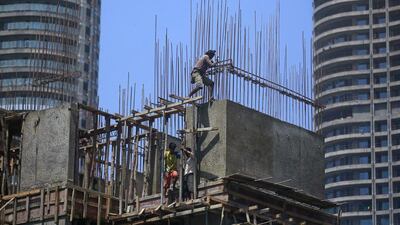 Labourers work at the construction site of a residential building in Mumbai’s central financial district. Danish Siddiqui / Reuters