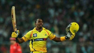 Chennai Super Kings batsman Dwayne Bravo celebrates after scoring the winning run of last ball six during the IPL Twenty20 cricket match between Kolkata Knight Riders and Chennai Super Kings at The Eden Gardens in Kolkata on May 14, 2012. RESTRICTED TO EDITORIAL USE. MOBILE USE WITHIN NEWS PACKAGE. AFP PHOTO/ DIBYANGSHU SARKAR *** Local Caption *** 515779-01-08.jpg