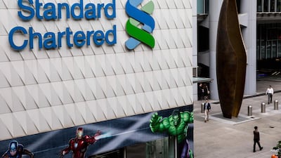 Standard Chartered signage in the Central district of Hong Kong. The lender posted a sharp rsie in profits for the first quarter. Isaac Lawrence/AFP