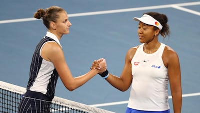 Karolina Pliskova, left, and Naomi Osaka shake hands at the net after their match in the Brisbane International semi-finals. AP Photo