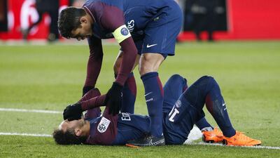 Neymar lies on the pitch after sustaining a broken bone in his foot during PSG's Ligue 1 clash with Marseille. Geoffrey van Der Hasslet / AFP