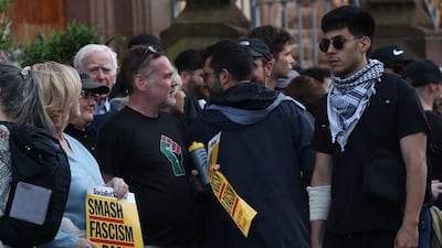 Residents join the Muslim community to protest against an anti-immigration rally in Liverpool. Reuters