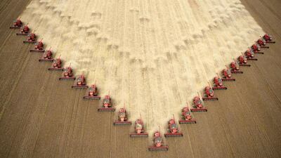 Workers harvest soybeans at a farm in Tangara da Serra in western Brazil. Paulo Whitaker / Reuters