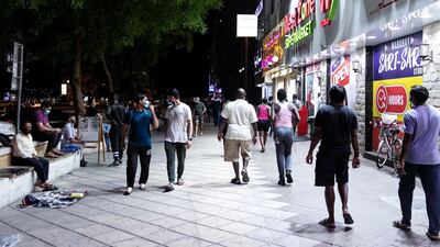 Some residents step out of their homes in the evening. Reem Mohammed / The National