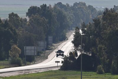 Israeli soliders ride in a Humvee near the Israel-Gaza border on February 5, 2024. Reuters.