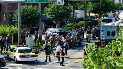 He said he was hiding under his desk along with other newspaper employees when the shooter stopped firing, the Capital Gazette reported on its website. Susan Walsh / AP Photo