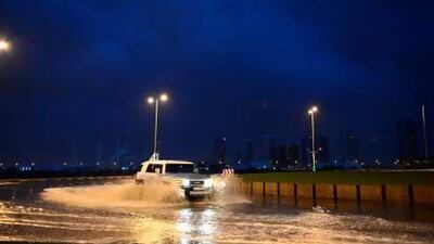 Motorists stopped to take pictures of the mountain rain causing a bad traffic jam on the Dubai-Fujairah road.