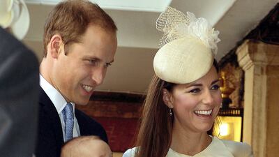 Prince William and Catherine, Duchess of Cambridge arrive holding their son Prince George, at Chapel Royal in St James's Palace, for his christening in October 2013. Getty Images