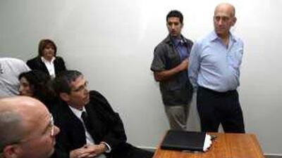 The former PM Ehud Olmert, right, is being investigated in a property bribery case, on top of the trial he is currently involved in over allegations of corruption.