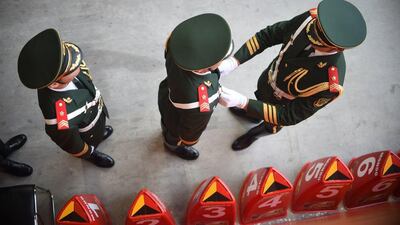 Chinese honour guards prepare for the the opening ceremonies of the 2015 IAAF World Championships in athletics on Saturday at Beijing's Bird's Nest. Johannes Eisele / AFP