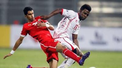 UAE's Ismail Al Hammadi, right, tries to hold of the tackle from Bahrain's Sami Al Housaini during their win this week. Mohammed Dabbous / Reuters
