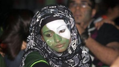 A Pakistani cricket fan in Dubai's Palladium arena watches her team lose to India in last night's semifinal World Cup match.