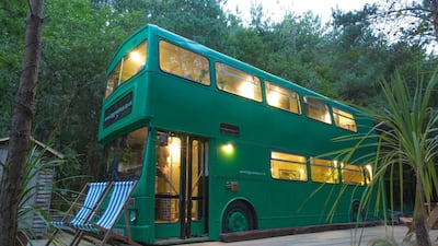 The Big Green Bus comfortably sleeps six people and features a fully fitted kitchen and lounge, a cosy log-burner and a bathroom with hot water, and is now parked up on farmland in Brighton on England's south coast. Courtesy Adam Collier-Woods