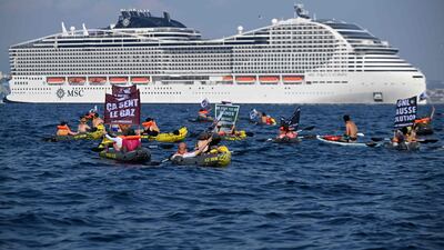 Activists from the 'Stop Croisieres' (Stop Cruises) NGO demonstrate as the MSC World Europa cruise ship leaves Marseille, France. AFP