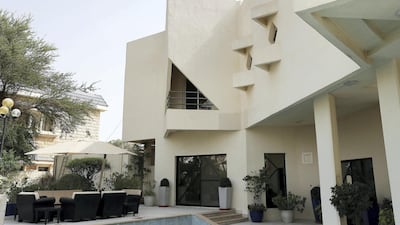 Designed in sharp angles, the balconies of the residence are shaded by triangular concrete canopies and the entrance is shaped like a pyramid. "There are no arches here," said one of the architectures company's founders. Pawan Singh / The National