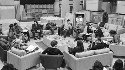 Writer/Director/Producer J.J. Abrams (top center in glasses) conducts a cast reading for Star Wars: Episode VII at Pinewood Studios in Buckinghamshire in this publicity photo taken and released to Reuters April 29, 2014. Clockwise from Abrams are Harrison Ford, Daisy Ridley, Carrie Fisher, Peter Mayhew, Producer Bryan Burk, Lucasfilm President and Producer Kathleen Kennedy, Domhnall Gleeson, Anthony Daniels, Mark Hamill, Andy Serkis, Oscar Isaac, John Boyega, Adam Driver and writer Lawrence Kasdan. David James / Reuters