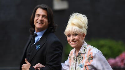 British former actress Barbara Windsor (R) and her husband Scott Mitchell (L) arrive in Downing Street in London, Britain, 02 September 2019. Windsor passed away on 10 December in London at the age of 83, according to a statement released by her husband on 11 December. EPA