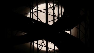 The supermoon illuminates a construction site in Tirana, Albania. AP