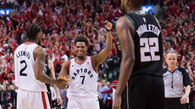 Toronto Raptors' Kyle Lowry celebrates with Kawhi Leonard. AP Photo