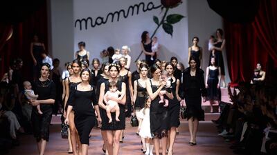 Italian actress Bianca Balti, second left, walks on the catwalk with models at the end of the show for fashion house Dolce & Gabbana at the women Fall / Winter 2015/16 Milan’s Fashion Week on March 1, 2015. AFP
