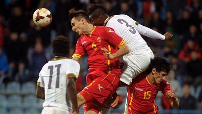 Asamoah Gyan (No 3) and Ghana lost to Montenegro 1-0. They'll play in Group G at the 2014 World Cup with Germany, Portugal and United States. Risto Bozovic / AP