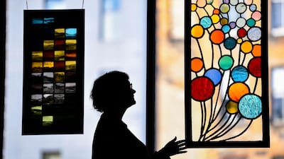 A woman views 40 Balloons by Carolyn Barlow at the Scottish Glass Societys Celebration exhibition at Trades House in Glasgow, Scotland. Getty Images