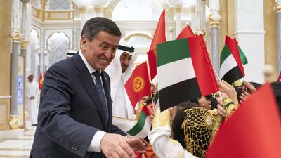 Sheikh Mohamed and President Jeenbekov greet schoolchildren during an official visit reception, at Qasr Al Watan. Ryan Carter / Ministry of Presidential Affairs