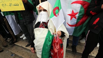An elderly Algerian woman protester joins a demonstration, in Algiers. EPA