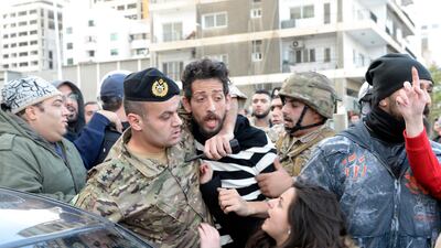 Lebanese army soldiers clash with anti-government protesters as they attempt to block a highway during a protest at the Jal El Dib area north of Beirut, Lebanon. EPA