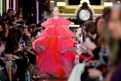 A pregnant Erin O'Connor walks the runway for Schiaparelli. AFP