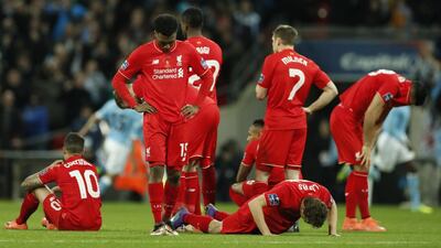 Liverpool players are dejected during the penalty shoot-out. Action Images via Reuters / John Sibley