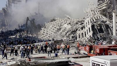 Fire and rescue workers search through the rubble of the World Trade Center in New York on September 13, 2001. EPA