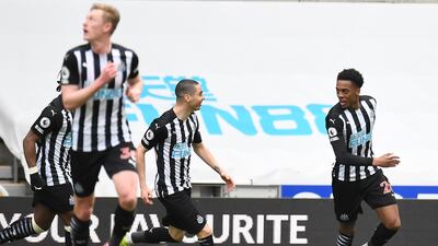 Joe Willock, right, celebrates with teammates after scoring Newcastle's second goal against Tottenham Hotspur. AP