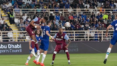 Aston Villa's Tyrone Mings battles with Chelsea's Jorginho. Antonie Robertson / The National
