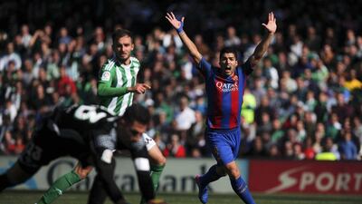 Barcelona striker Luis Suarez, right, appeals for a goal. He would later score the equaliser in the final minute. Jon Nazca / Reuters