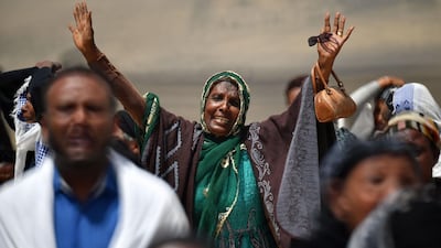 A distraught relative reacts as she arrives at the crash site. AFP