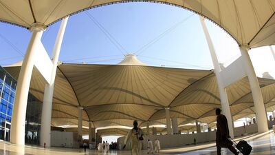 People walk outside the King Abdulaziz Airport upon their arrival to the Red Sea port city of Jeddah. AFP