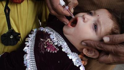 A reader praises volunteers who administer poli vaccines to children in Pakistan. KM Chaudary / AP Photo