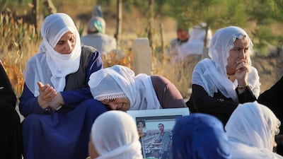 The mother of 21-year-old Kurdish fighter Serhat Binen mourns at his grave in the town of Silvan in eastern Turkey. Mr Binen was killed fighting Turkish security forces in Silvan as Kurdish militants push for greater autonomy in eastern Turkey. Josh Wood/The National