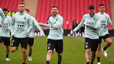 Lionel Messi (C) trains with Argentina teammates on the eve of the Finalissima Conmebol. EPA