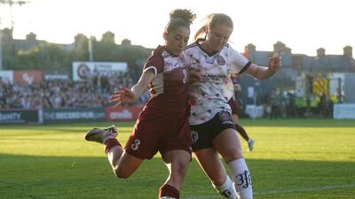 A Bohemians player tackles a determined Palestinian national team member at Dalymount Park. PA