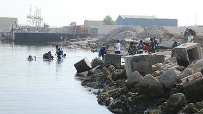 More than 50 divers volunteer to clean up the Mussaffah Canal on Sunday. Abu Dhabi Municipality