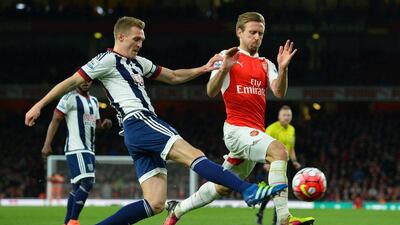 West Brom midfielder Darren Fletcher, left, battles with Arsenal defender Nacho Monreal. Glyn Kirk / AFP
