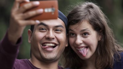 You can take happy snaps, but not record your feelings with a smartphone or camera. (Marco Ugarte / AP)