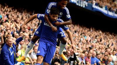 Diego Costa, below, celebrates with Willian after a goal against Aston Villa in September. Jamie McDonald / Getty Images / September 27, 2014