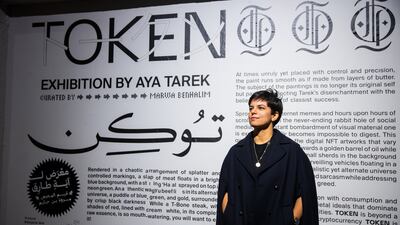 Egyptian visual artist Aya Tarek attends the launch of her latest exhibition Token, which opened in Downtown Cairo's Kodak Passageway on Thursday. Photo: Marwa Benhalim