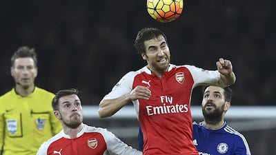 Arsenal’s French midfielder Mathieu Flamini wins a header during the English Premier League match between Arsenal and Chelsea at the Emirates Stadium on January 24, 2016. AFP