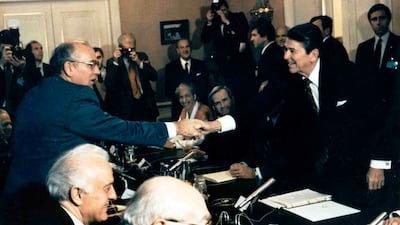 Soviet leader Mikhail Gorbachev, left, shakes hands with Ronald Reagan, the US president at the time, at the Geneva conference in November 1985. AP